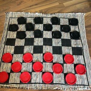 Fun double sided game.   Checkers on one side tic tac toe on the other.